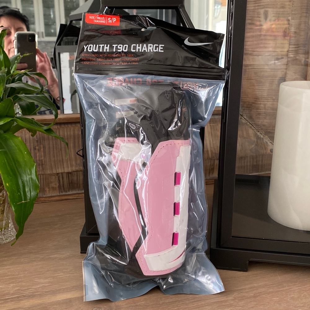 Nike Youth T90 Charge shin guards size small.